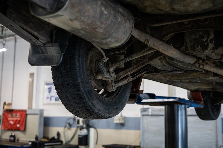 Expert mechanic performing tire installation